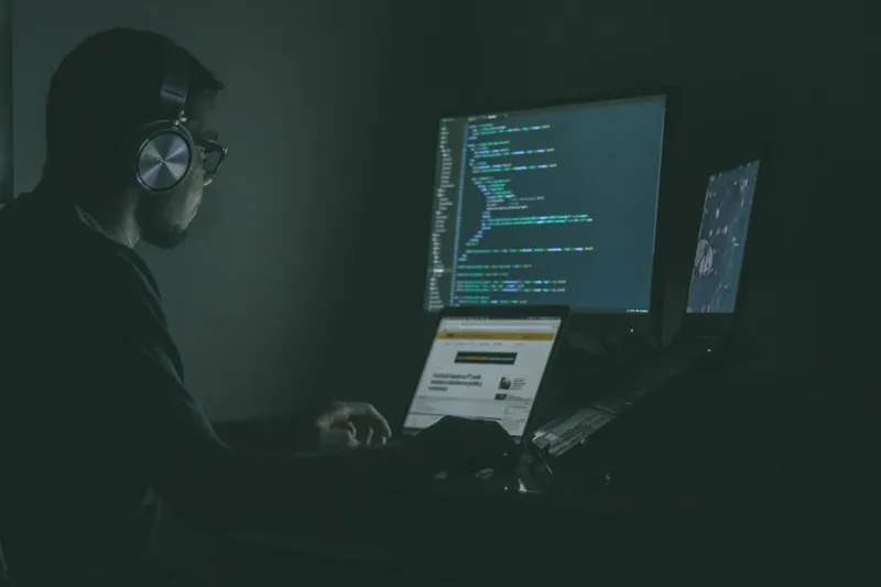 Penetration tester at multi-monitor setup